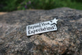 Beyond Your Expectations Lapel Pin