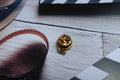 Film Reel Gold Lapel Pin