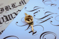 Quill Gold Lapel Pin
